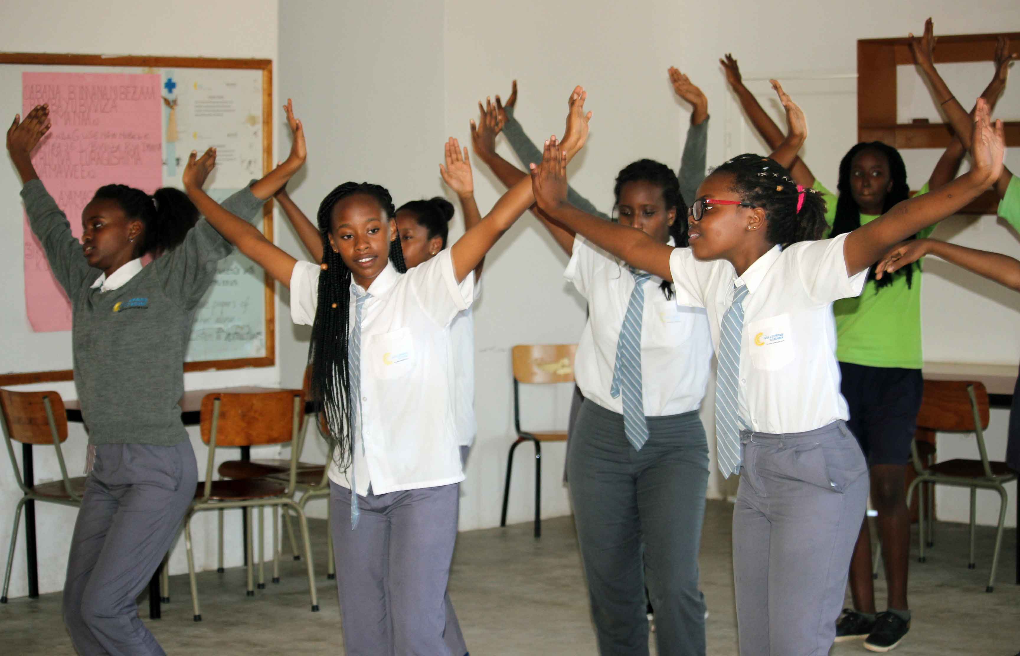 students dancing traditional Rwandan dance