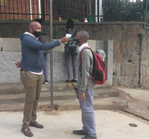 A student being screened by an agent of Health care